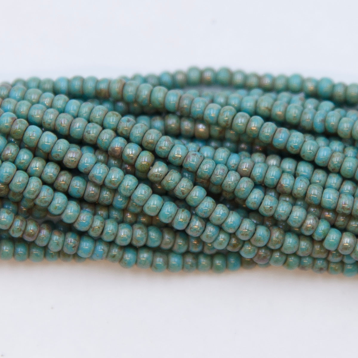 10SB165-52R: CZ Seed Bead Turquoise Blue Travertine Stone 10/0-1HK
