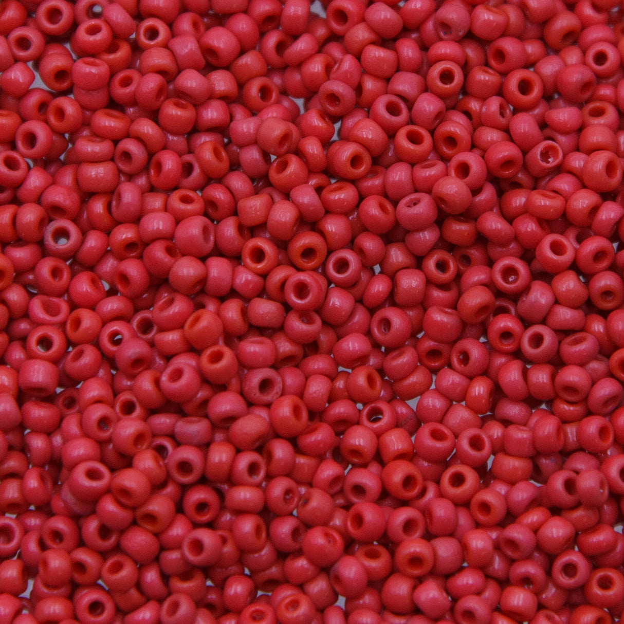 10SV100-38: Vintage Venetian Seed Bead Op Melon Red 10/0