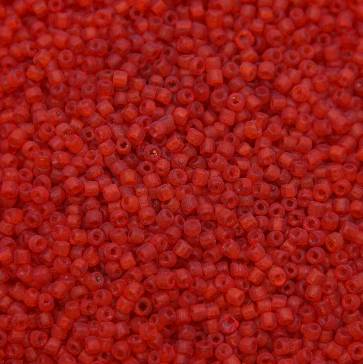 12SV236-7UR: Vin Venetian Seed Bead Trans Red Orange Unfinished SQ-HOLE 12/0-50GMs