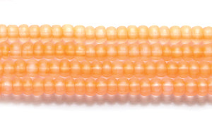 10SB638-NT: CZ Seed Bead Neon Orange On Crystal 10/0 5HK