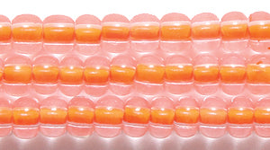 6SB734-N: CZ Seed Bead Neon Lined Orange 6/0 Uv Reactive 36STR