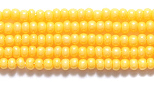 11SB126-TA: CZ Seed Bead Terra DK Yellow 11/0 6HK