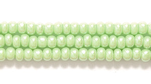 10SB381: CZ Seed Bead Sfinx LT Green 10/0 5HK