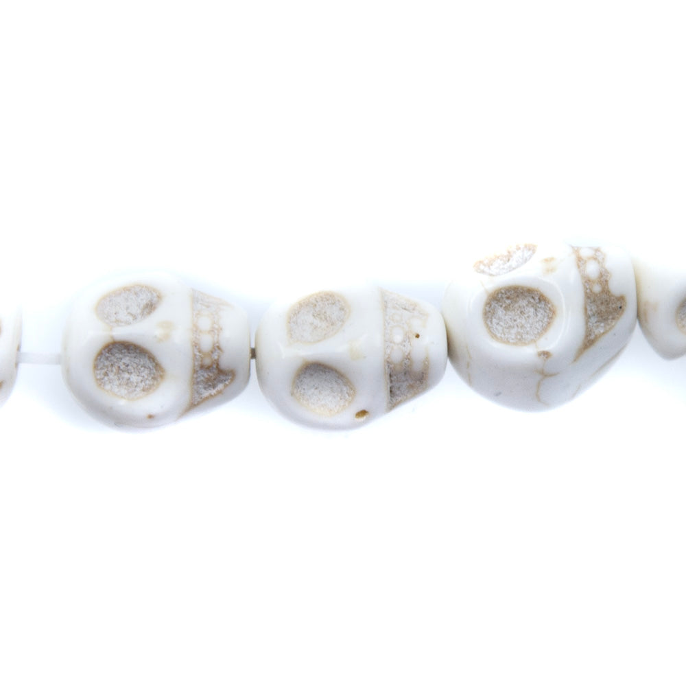 1ST50-T: 12x10mm White Magnesite Skull Beads 15.5"
