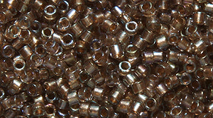 14SD7753: DB2396 Delica Fancy Line Champagne 11/0 - 50GM