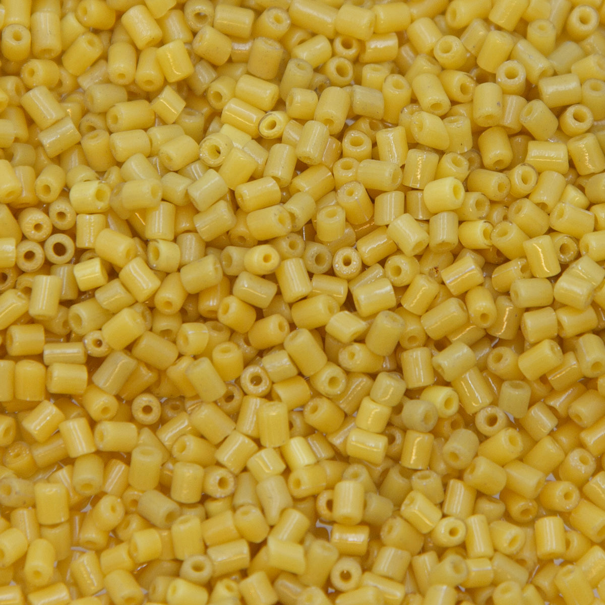 30SV120-32: Vintage Venetian Tran Goldenrod Tube 1X3MM - 500 Grams