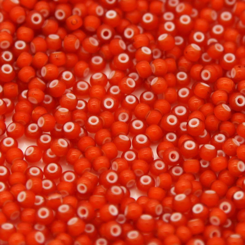 6SB234-WHL: CZ Seed Bead White Heart Orange 6/0 50GM