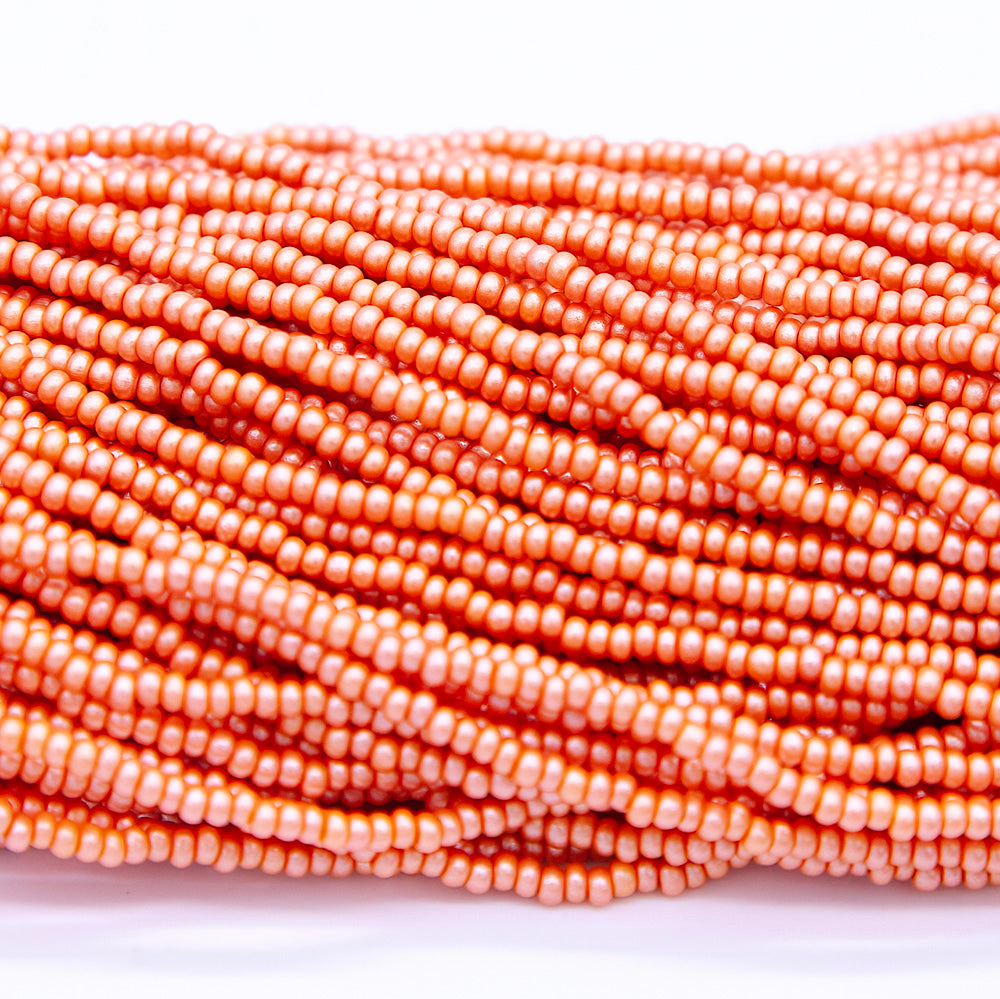 10SB933-PR: CZ Seed Bead Permalux Apricot 10/0 1HK