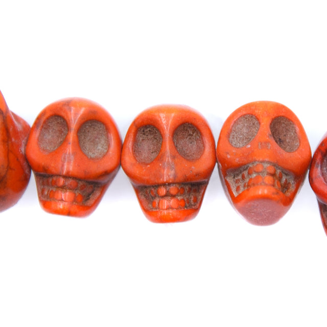 6ST50-O: 14x10mm Orange Magnesite Skull Beads 15.5"