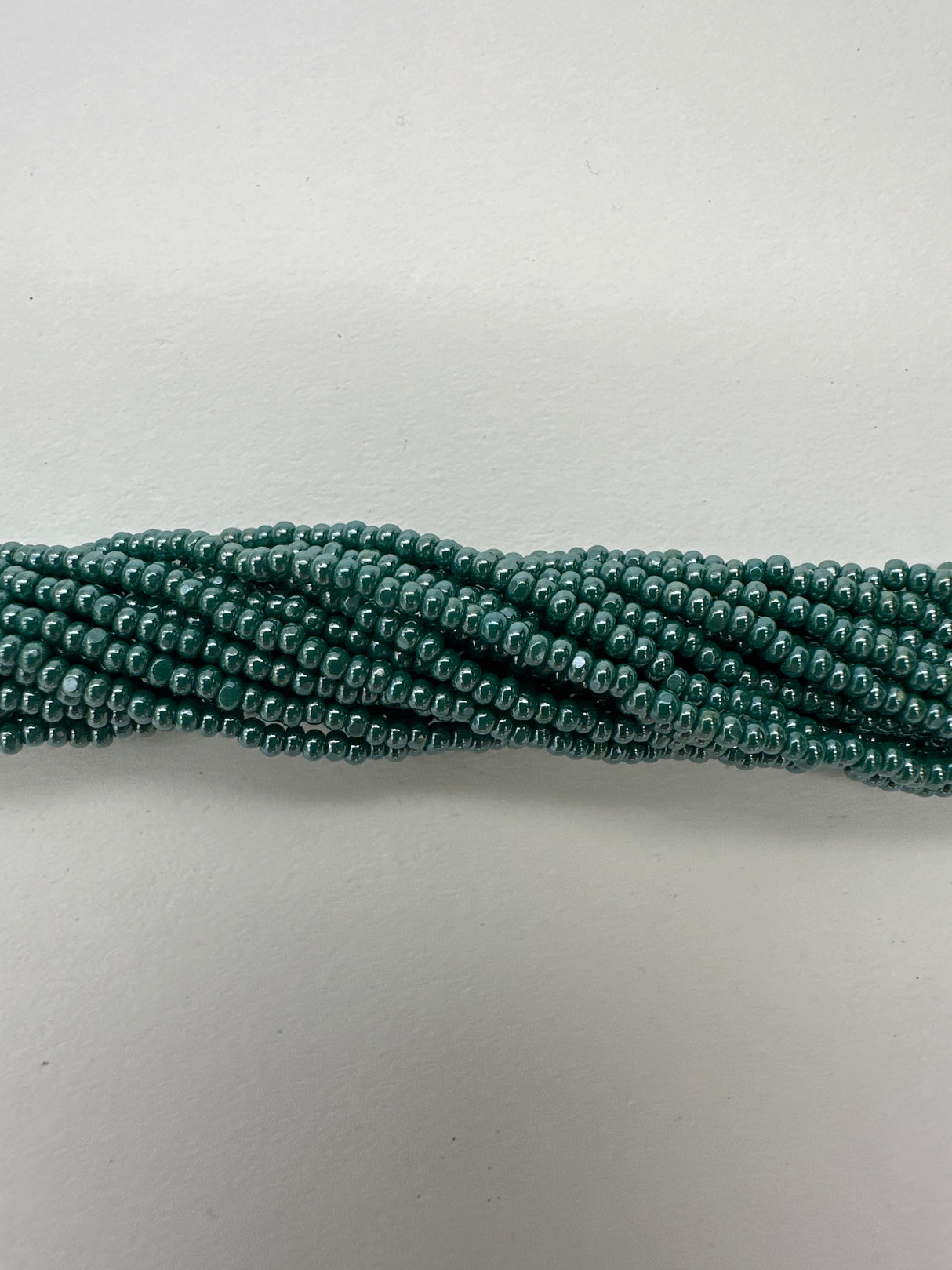 11SB386-CR: CZ Seed Bead True Cut Sfinx DK Green 11/0 - 1HK