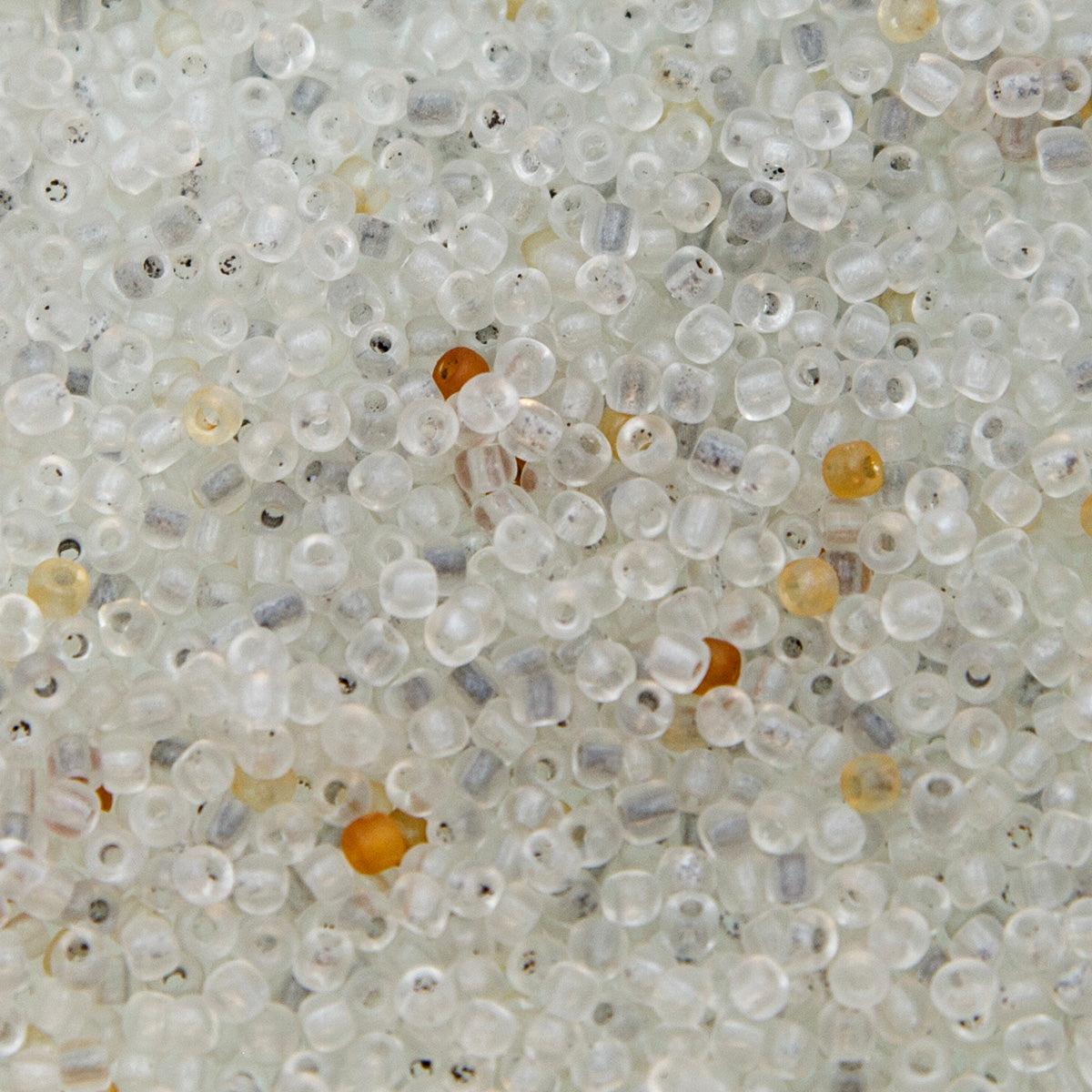 9SV100-13: Vintage Venetian Sh Transparent Milky Crystal 9/0 250 Grams