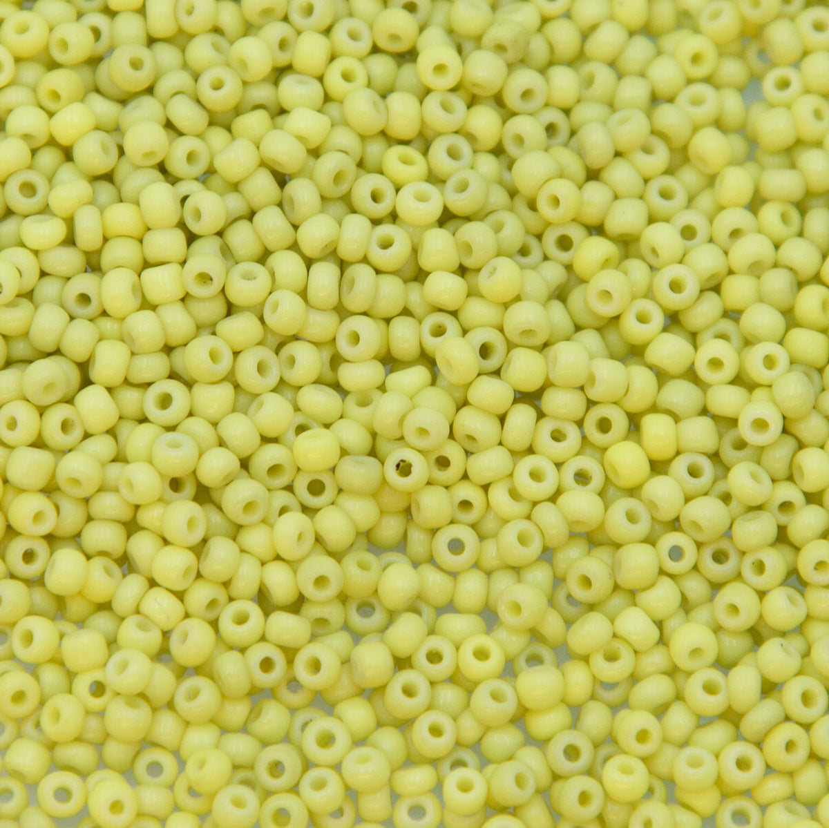 9SV100-40: Vintage Venetian Seed Bead Op Pale Yellow 9/0