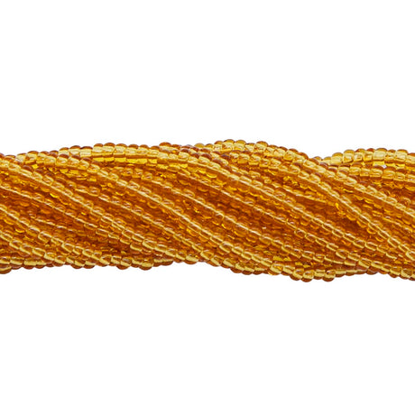10SB254R: CZ Seed Bead Trans Topaz 10/0-1HK