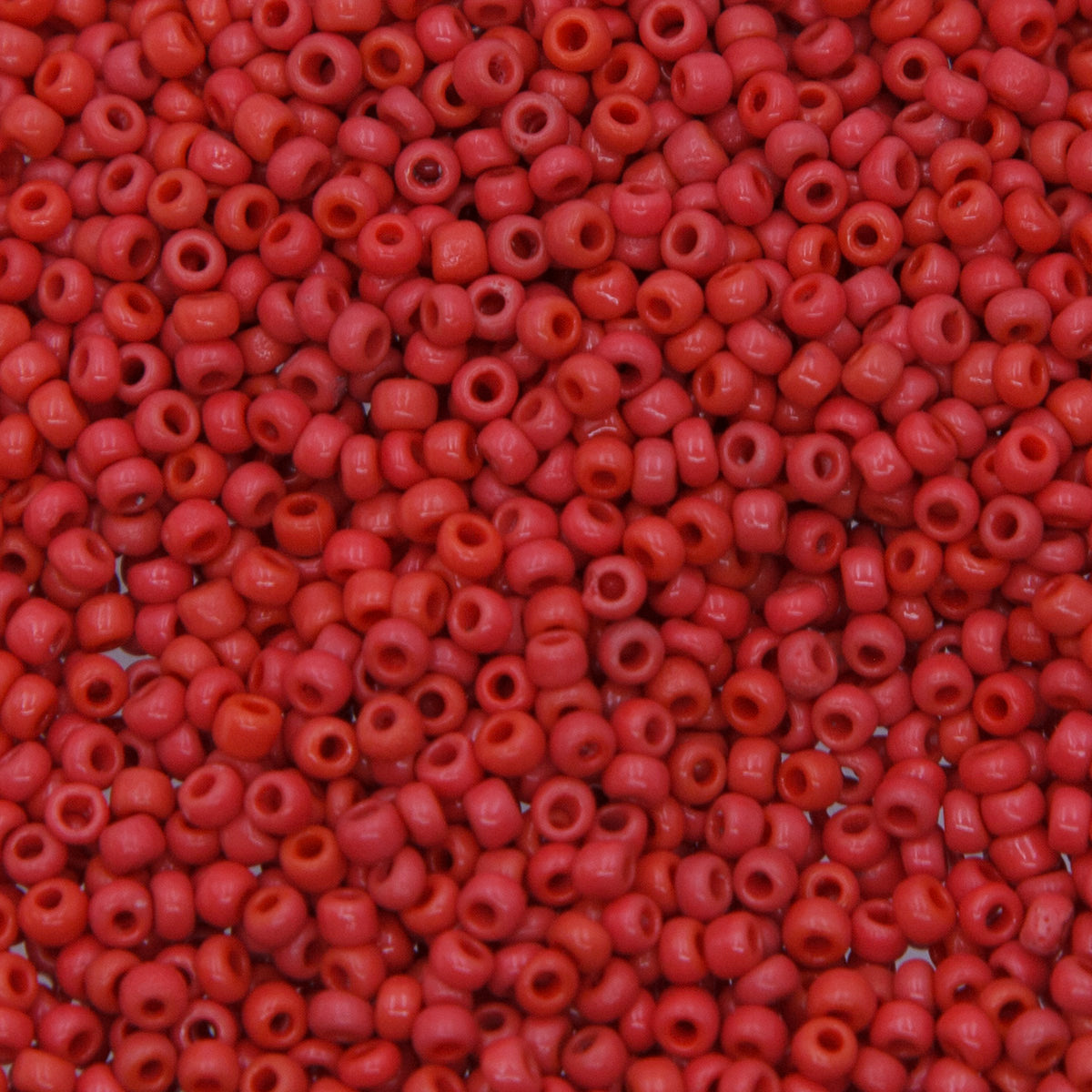 10SV100-38: Vintage Venetian Seed Bead Op Melon Red 10/0