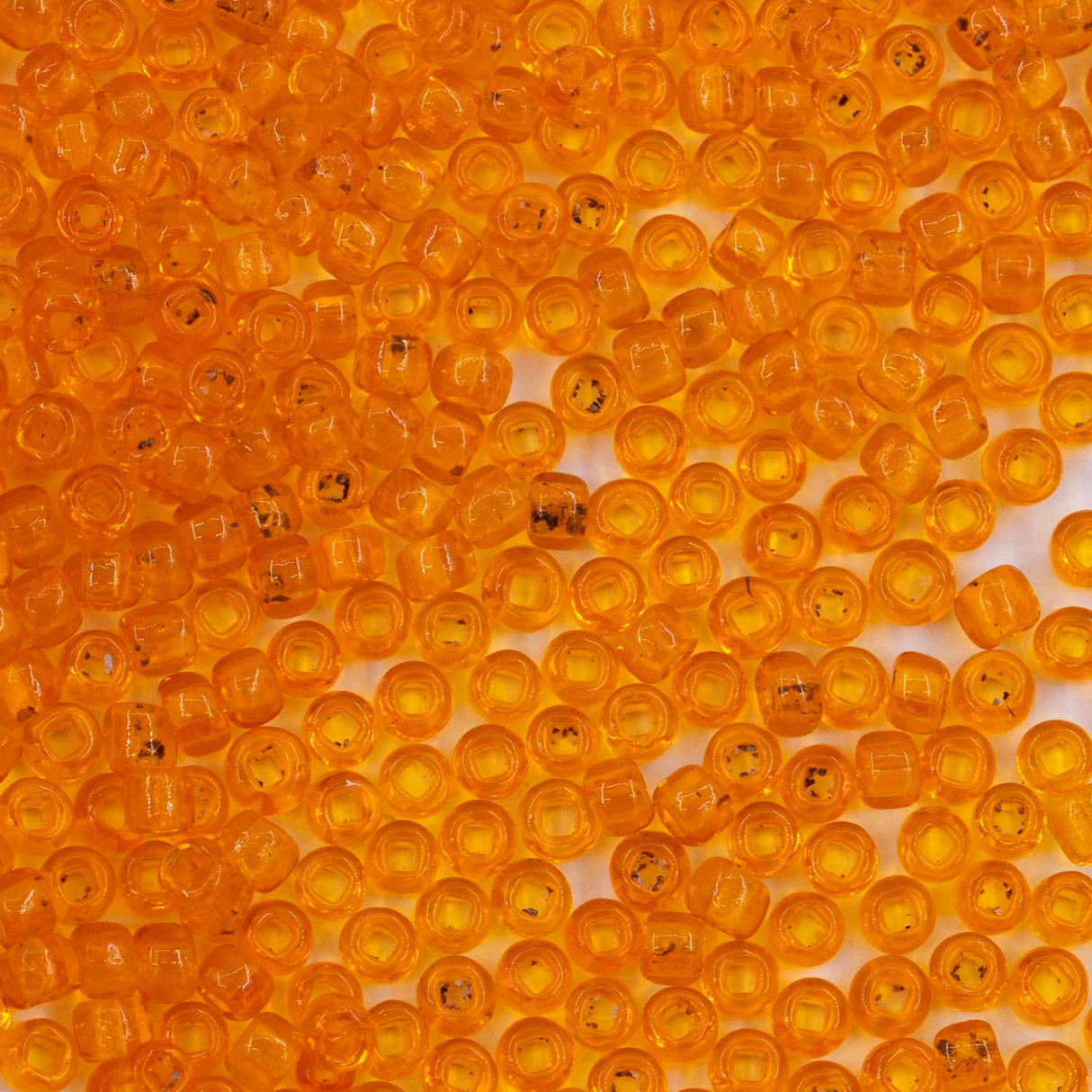 10SV236-6SQ: Antique Venetian 10/0 Seed Bead Transparent Orange #6 Square Hole - 10 Grams