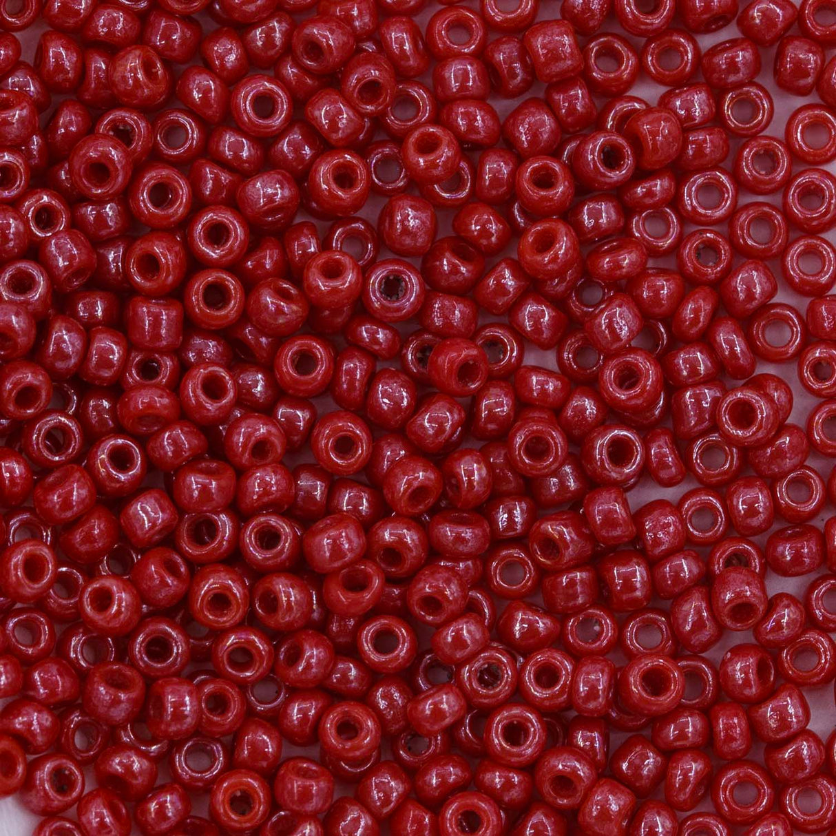 10SV347-1: Antique Venetian 10/0 Seed Bead Opaque Luster Red #1 - 10 Grams