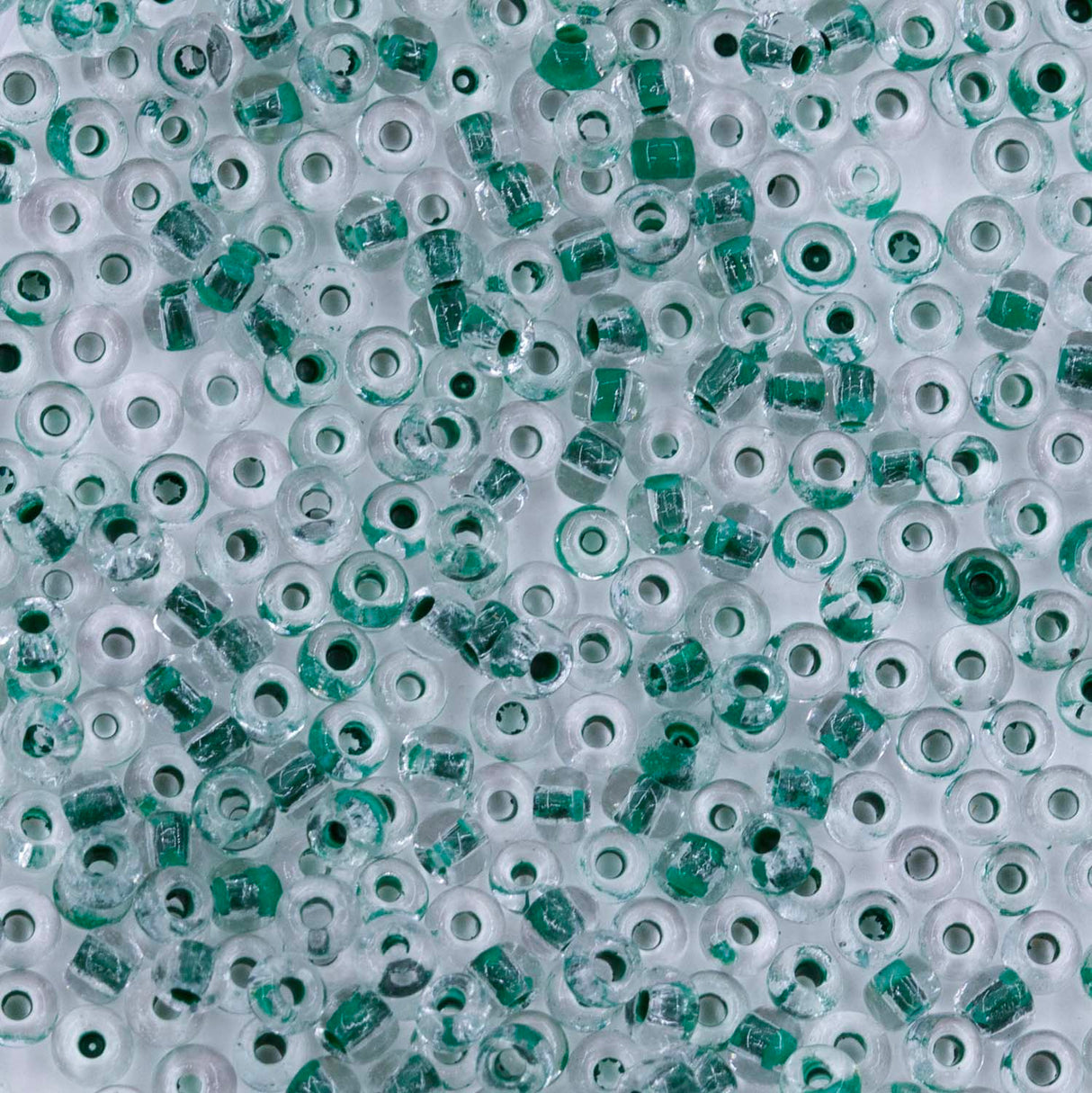 10SV785: Antique Venetian 10/0 Seed Bead Color Lined Clear Green - 10 Grams