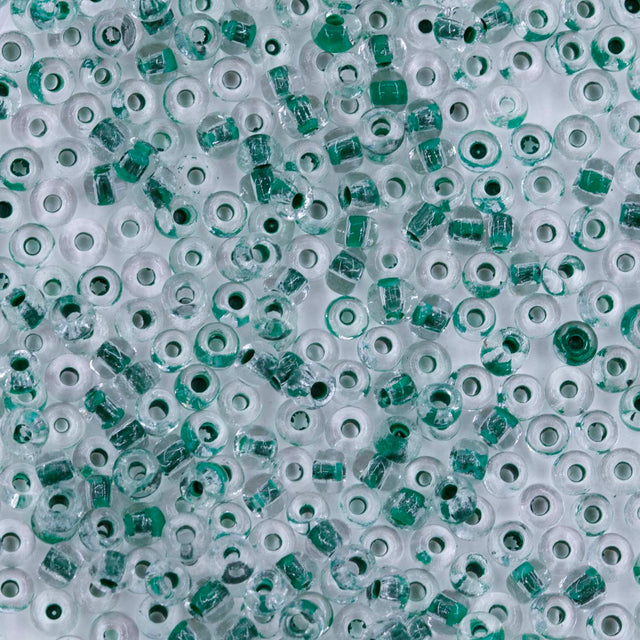 10SV785: Antique Venetian 10/0 Seed Bead Color Lined Clear Green - 10 Grams