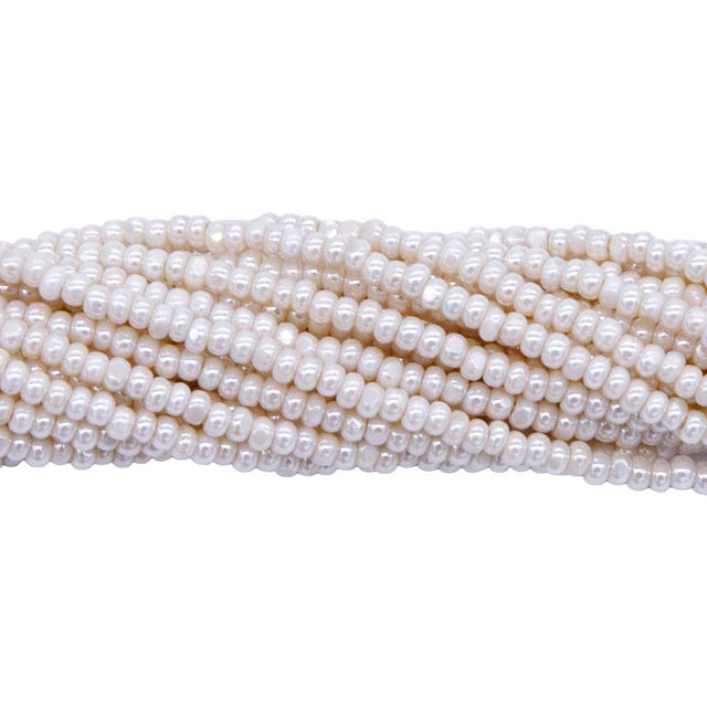 11SB652-CR: CZ Seed Bead True Cut Pearl Egg Shell 11/0-1HK