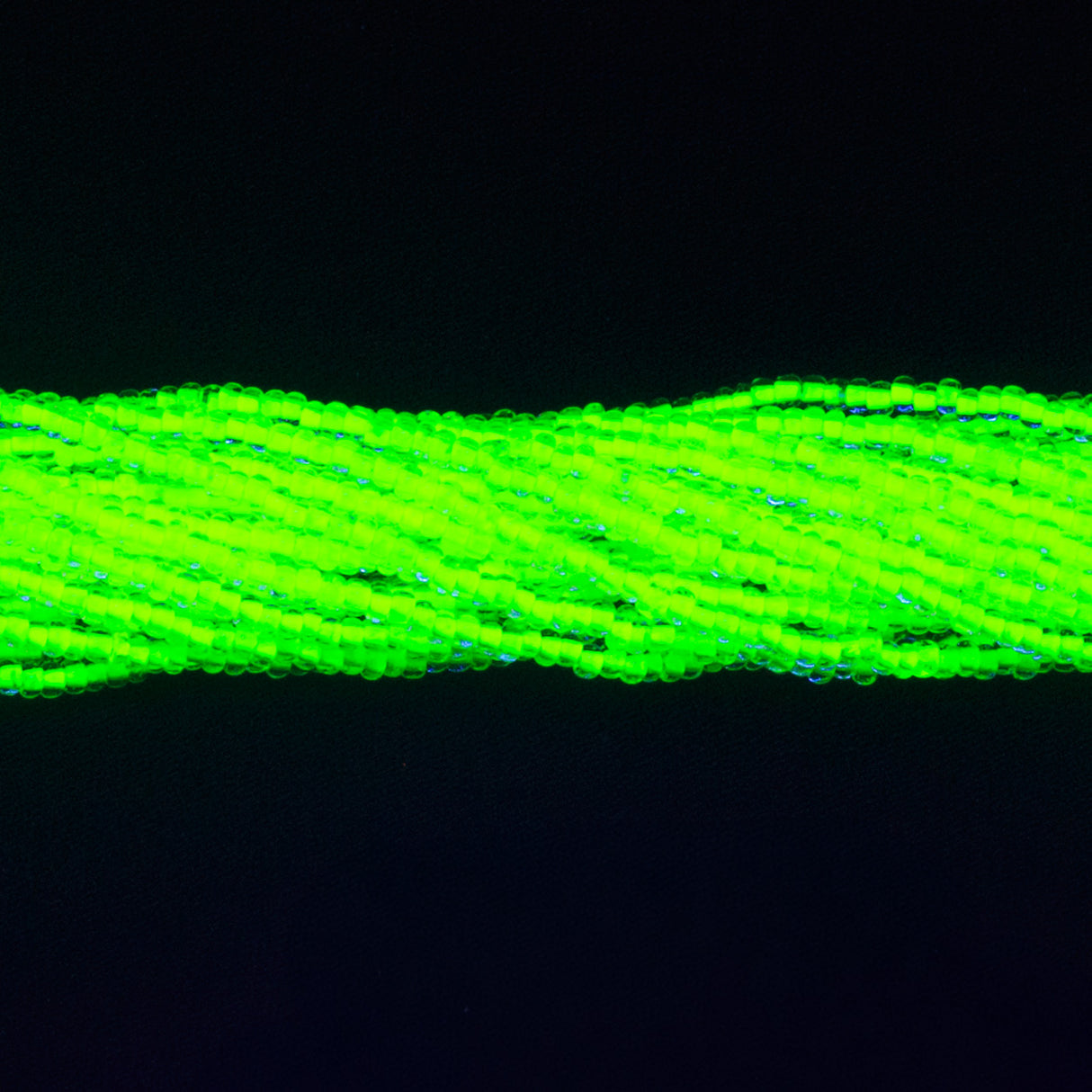11SB723-NR: CZ Seed Bead Neon Lined Yellow 11/0 Uv Reactive-1HK