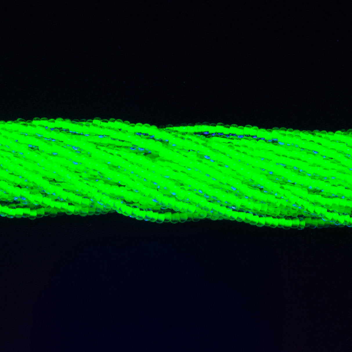 11SB784-NR: CZ Seed Bead Neon Lined Green 11/0 Uv Reactive-1HK