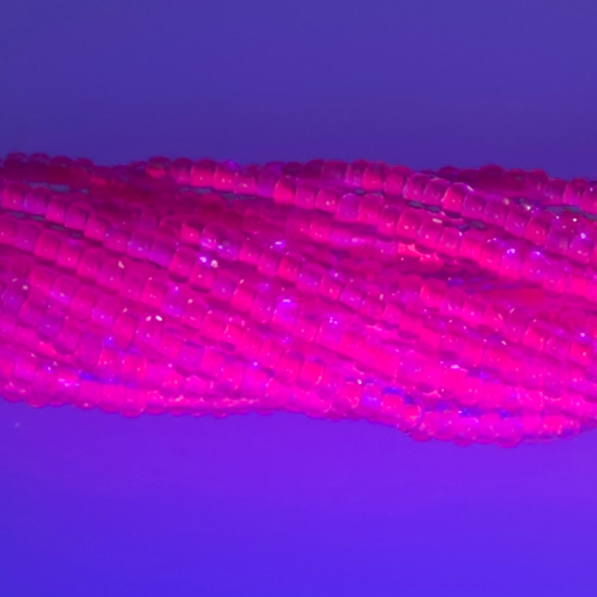 11SB793-NR: CZ Seed Bead Neon Lined Pink 11/0 Uv Reactive-1HK