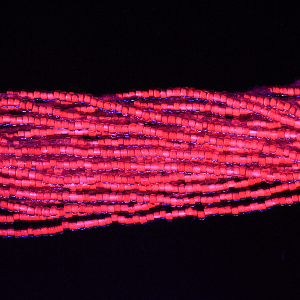 11SB798-N: CZ Seed Bead Neon Lined Purple 11/0 Uv Reactive 6HK