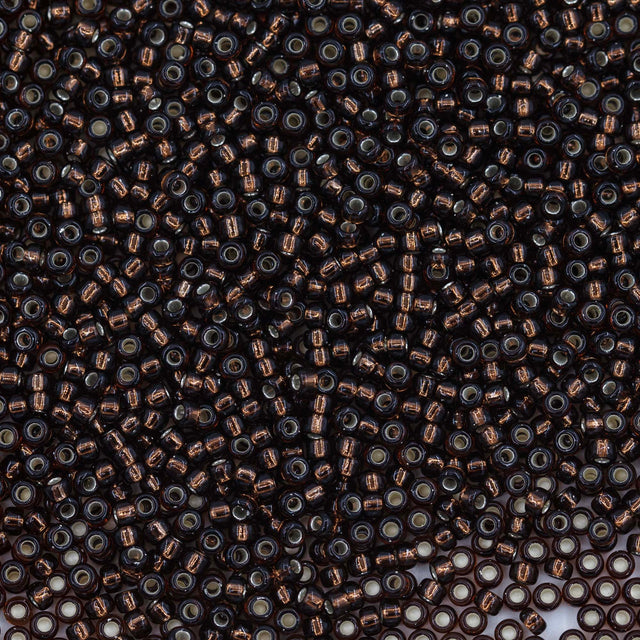 11SM458R: 11-0029R Miyuki Seed Bead 11/0 Root Beer Silver Lined - 25GM