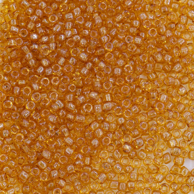 11SV354-T1SQ: Antique Venetian 11/0 Seed Bead Transparent Luster Raw Sienna #1 Square Hole - 10 Grams