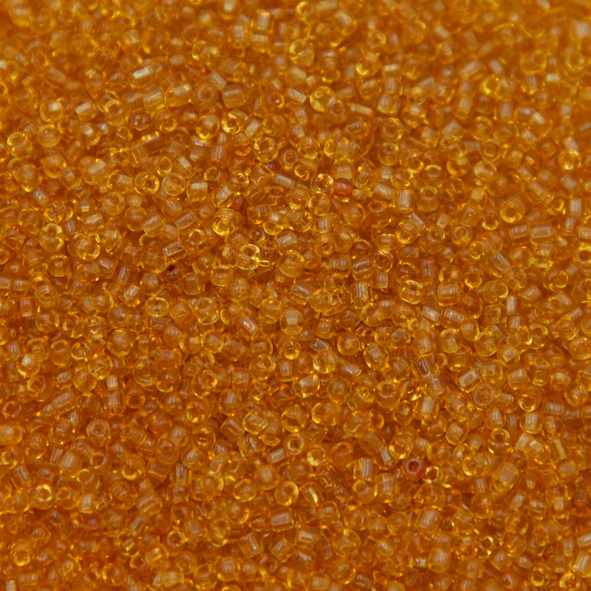 12SV253-5R: Vin Venetian Seed Bead Trans Gold #5 SQ-HOLE 12/0-50GMs