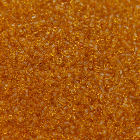 12SV253-5R: Vin Venetian Seed Bead Trans Gold #5 SQ-HOLE 12/0-50GMs