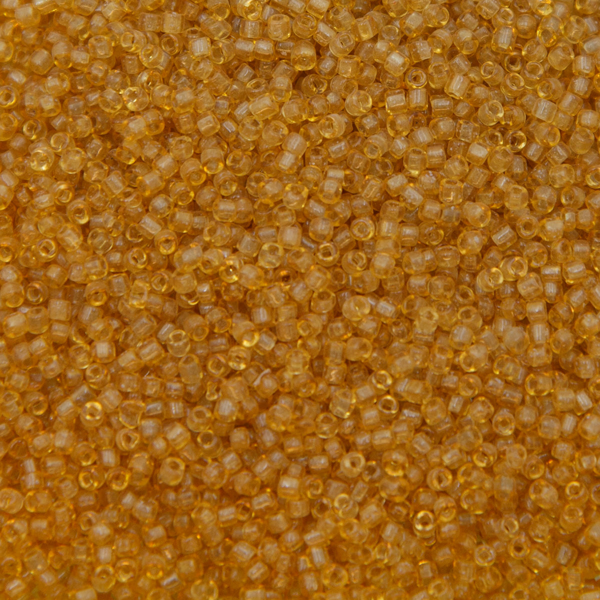 12SV253-7QR: Vin Venetian Seed Bead Trans Gold #7 SQ-HOLE 12/0-50GMs