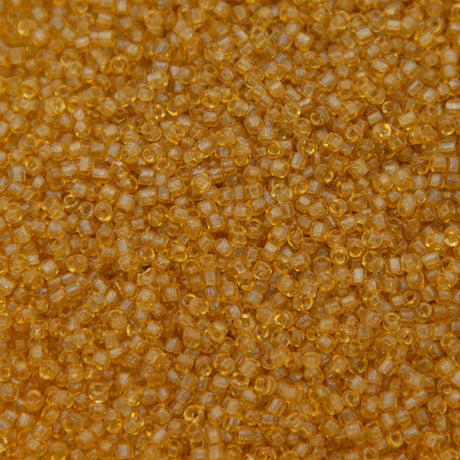 12SV253-7R: Vin Venetian Seed Bead Trans Gold #7 SQ-HOLE 12/0-50GMs