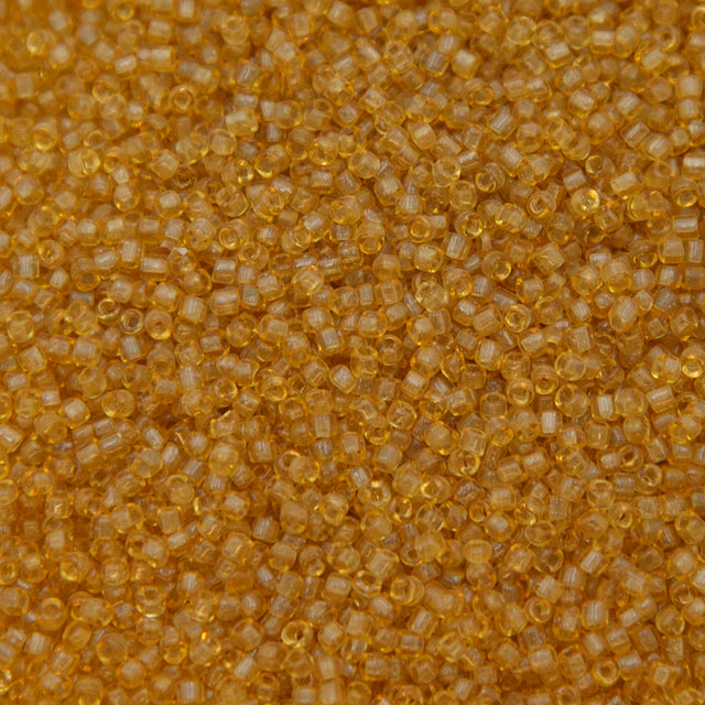 12SV253-7R: Vin Venetian Seed Bead Trans Gold #7 SQ-HOLE 12/0-50GMs
