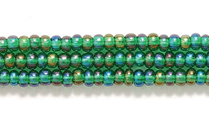 10SB584-TR: CZ Seed Bead Trans Christmas Green AB 10/0-1HK
