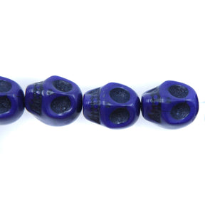 1ST50-DB: 12x10mm Lapis Magnesite Skull Beads 15.5"