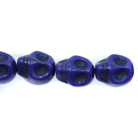 1ST50-DB: 12x10mm Lapis Magnesite Skull Beads 15.5"