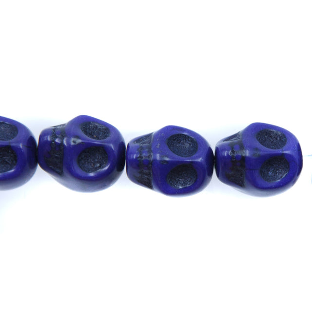 1ST50-DB: 12x10mm Lapis Magnesite Skull Beads 15.5"