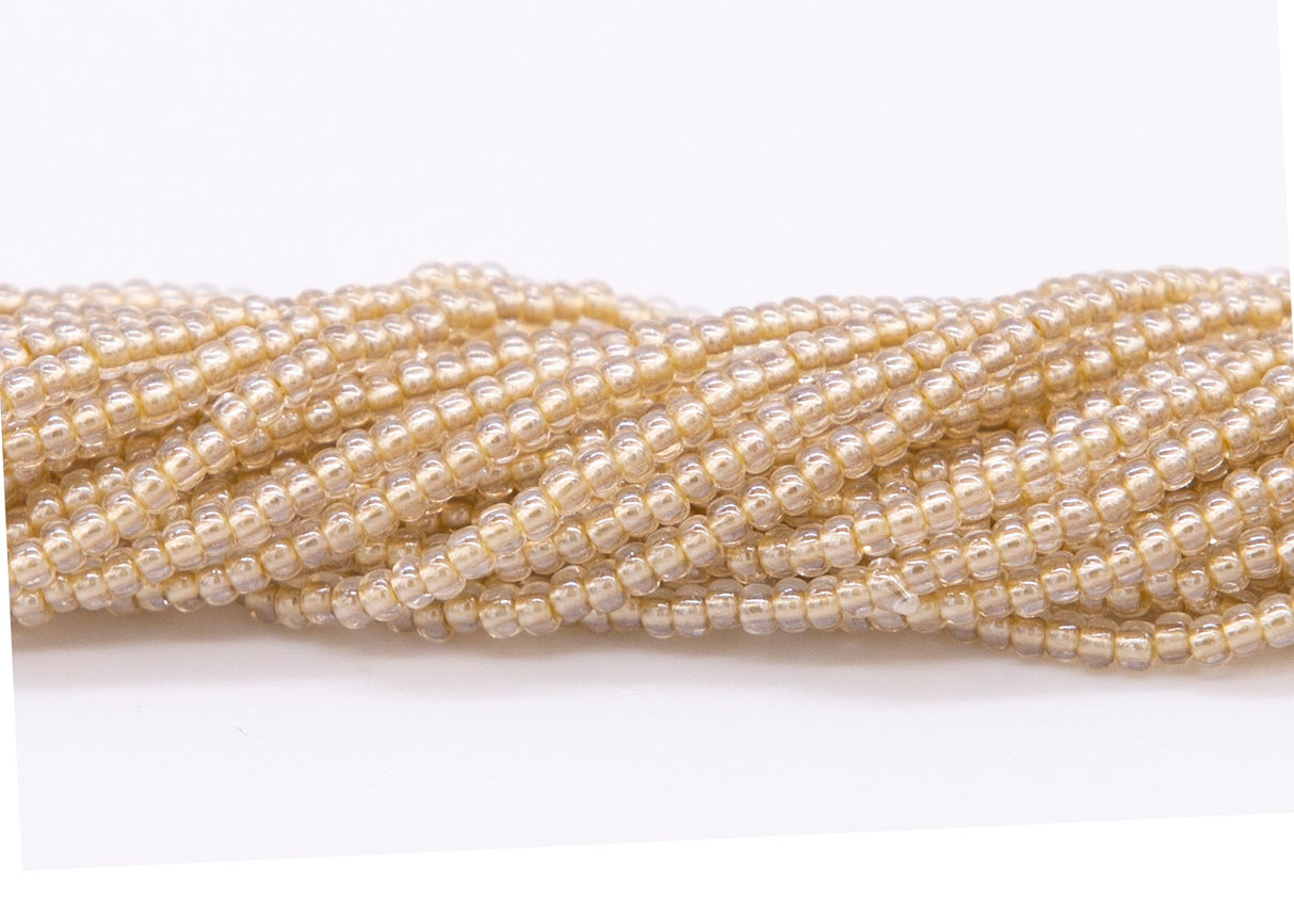 10SB656-LPR: CZ Seed Bead Pastel Pearl Lined Copper 10/0-1HK