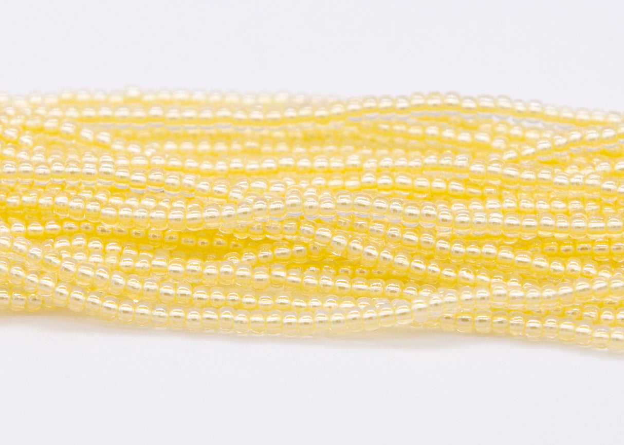 10SB622-LP: CZ Seed Bead Pastel Pearl Lined Yellow 10/0 5HK
