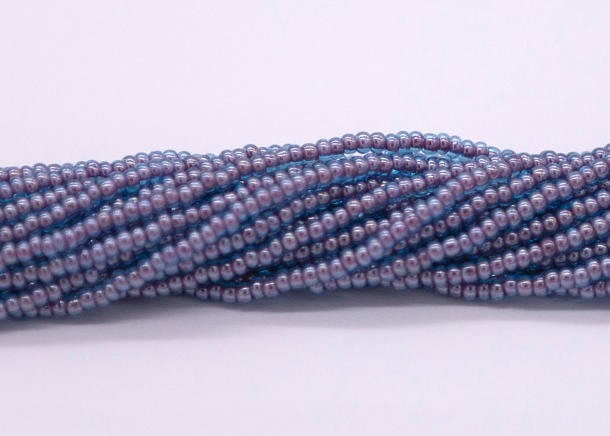 10SB764: CZ Seed Bead Colorlined Magenta 10/0 5HK