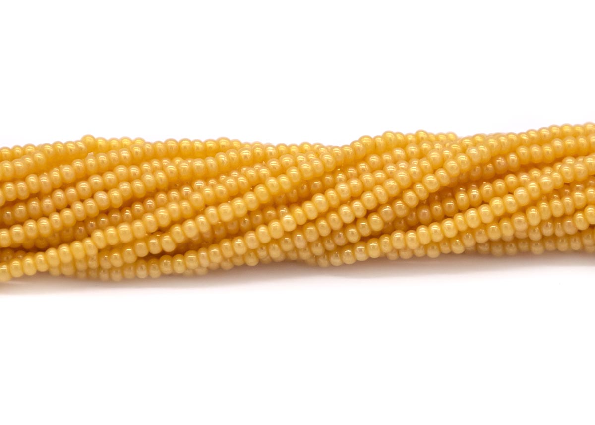 11SB626R: CZ Seed Bead Pearl DK Yellow 11/0-1HK