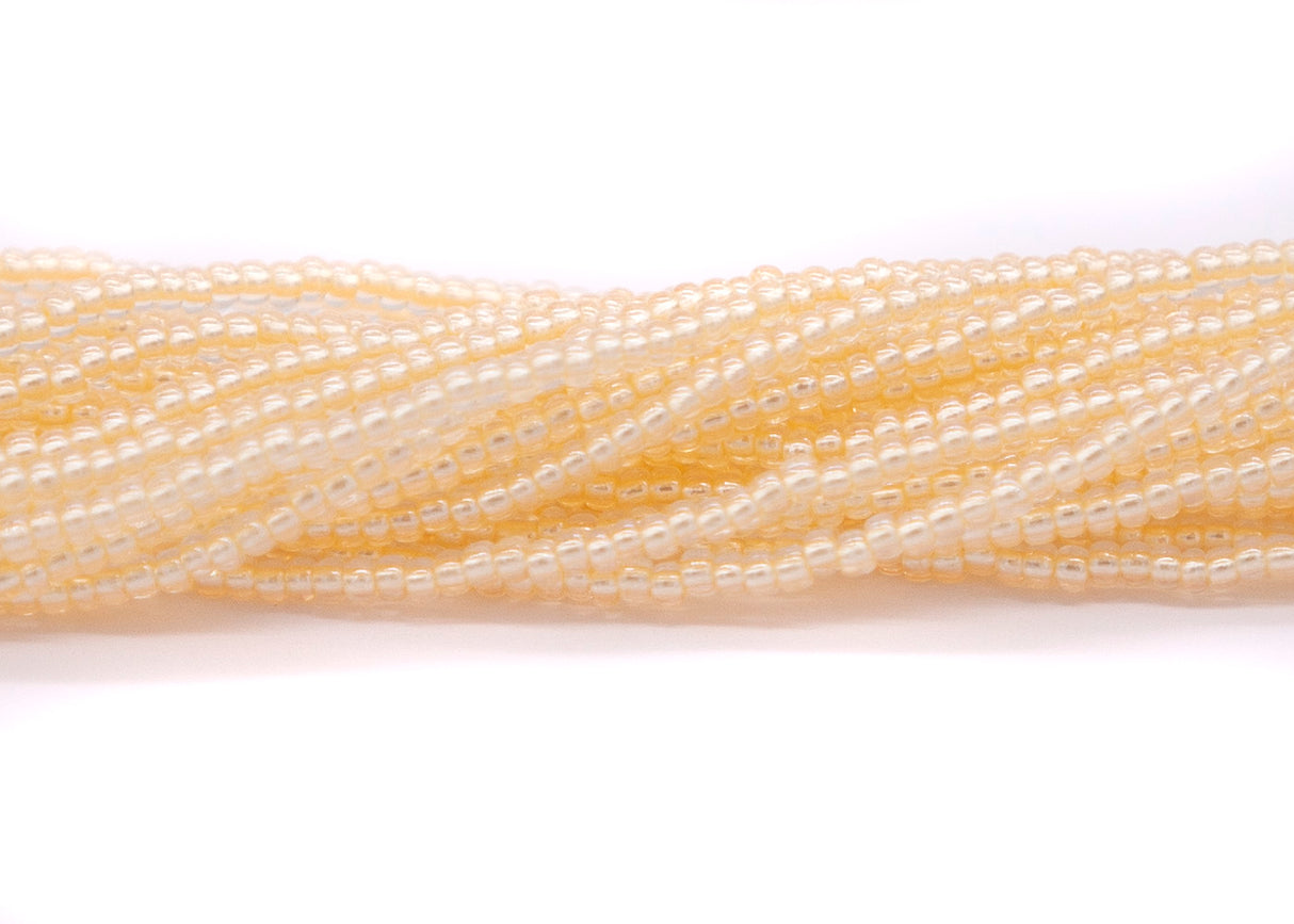 10SB652-LPR: CZ Seed Bead Pastel Pearl Lined LT Gold 10/0-1HK