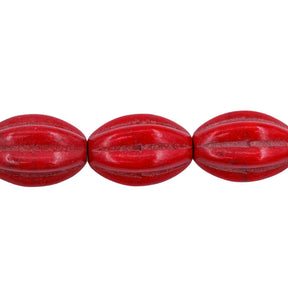 31ST612-R: 10x14mm Red Magnesite Oval Pumpkin Beads 15.5"