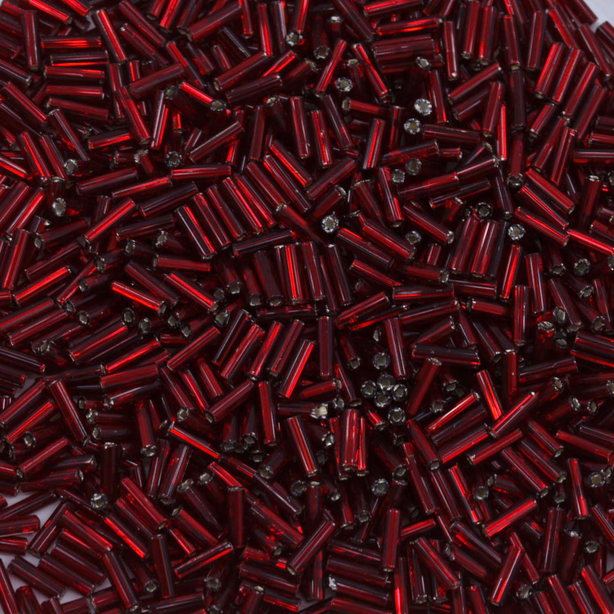 3BB446-L: CZ Bugle Bead SIL Line Garnet Round Hole #3-50GM