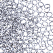5FI224-IRR: USA Made Brass Oval Jump Ring Imitation Rhodium Finish 4.4x5.2mm 21 Gauge 5 Gram