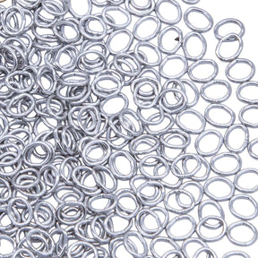 5FI224-IRR: USA Made Brass Oval Jump Ring Imitation Rhodium Finish 4.4x5.2mm 21 Gauge 5 Gram