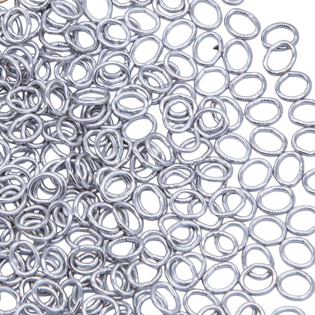 5FI224-IRR: USA Made Brass Oval Jump Ring Imitation Rhodium Finish 4.4x5.2mm 21 Gauge 5 Gram