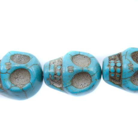5ST50-B: 23x18mm Blue Magnesite Skull Beads 15.5"