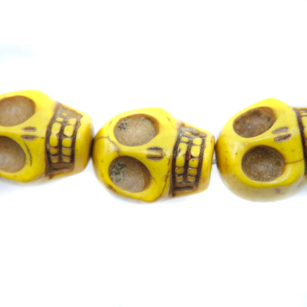 5ST50-Y: 23x18mm Yellow Magnesite Skull Beads 15.5"
